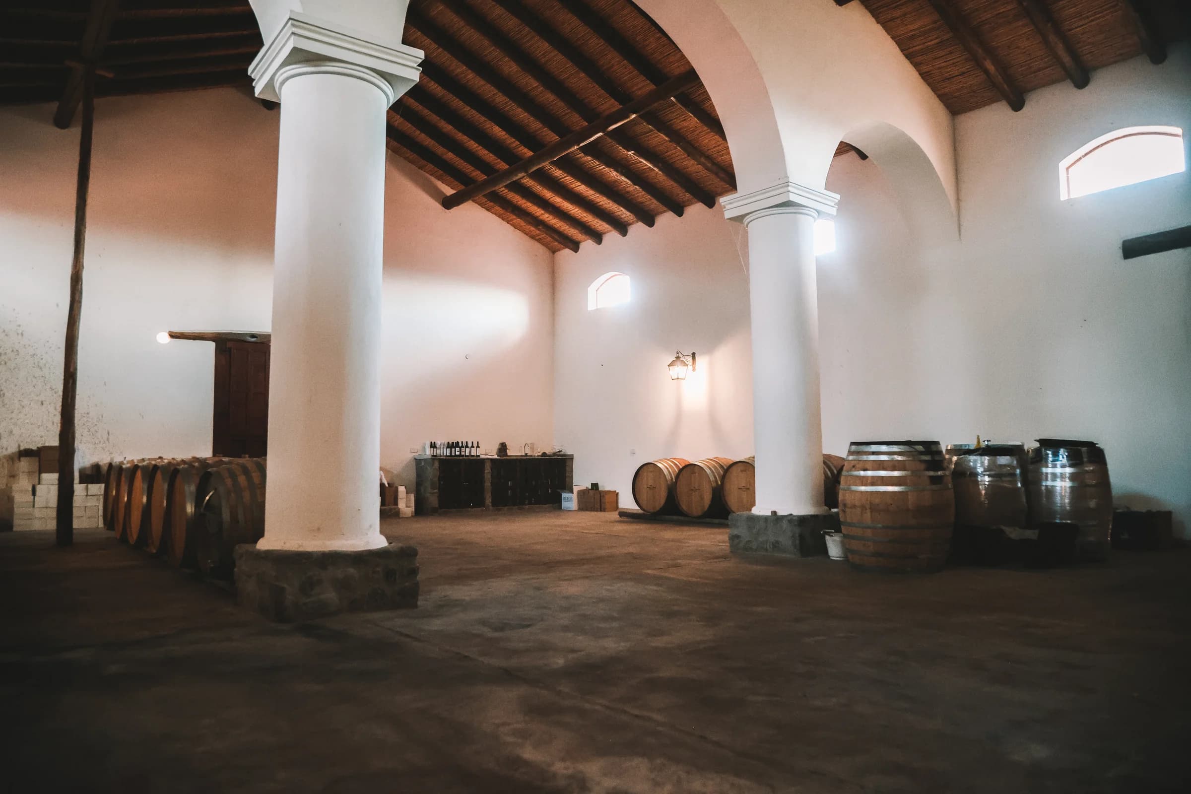 Inside the Arca Yaco winery with oak barrels
